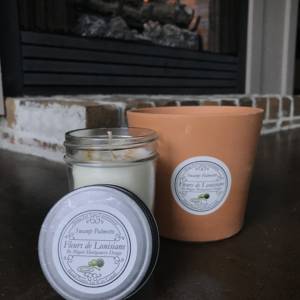 Swamp palmetto scented candle in front of fire place