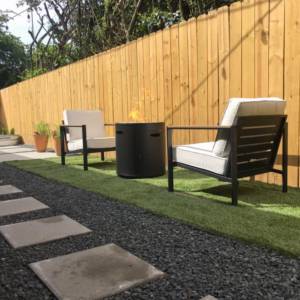 gravel path with pavers and seating area wood background